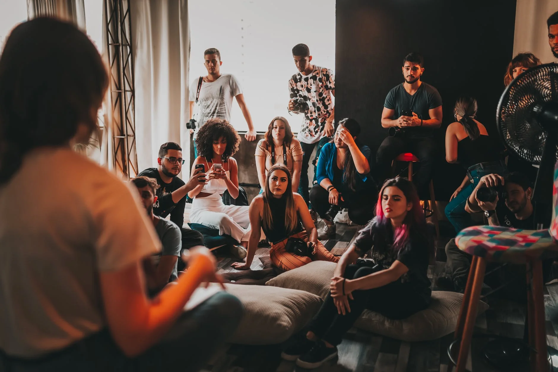 Build Online Business Website, Targeting A Audience Helpful | Start Entrepreneur Online group of multiethnic people gathering around female speaker in studio