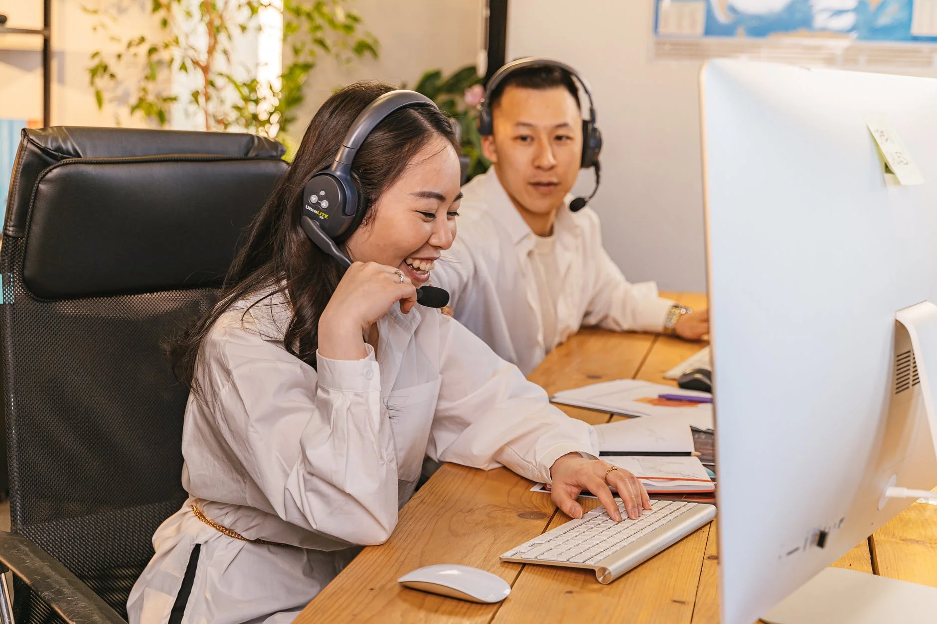 woman and man wearing headphones
